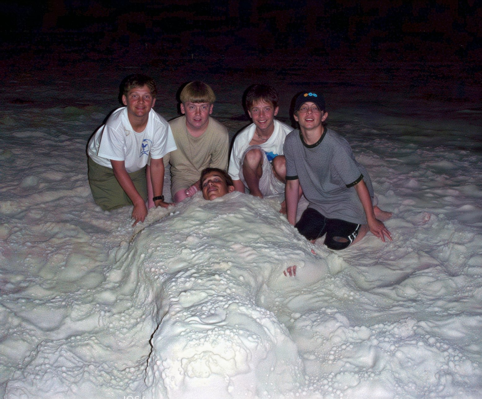 Burying the team in the sand after a game.  Great to be staying at the beach.