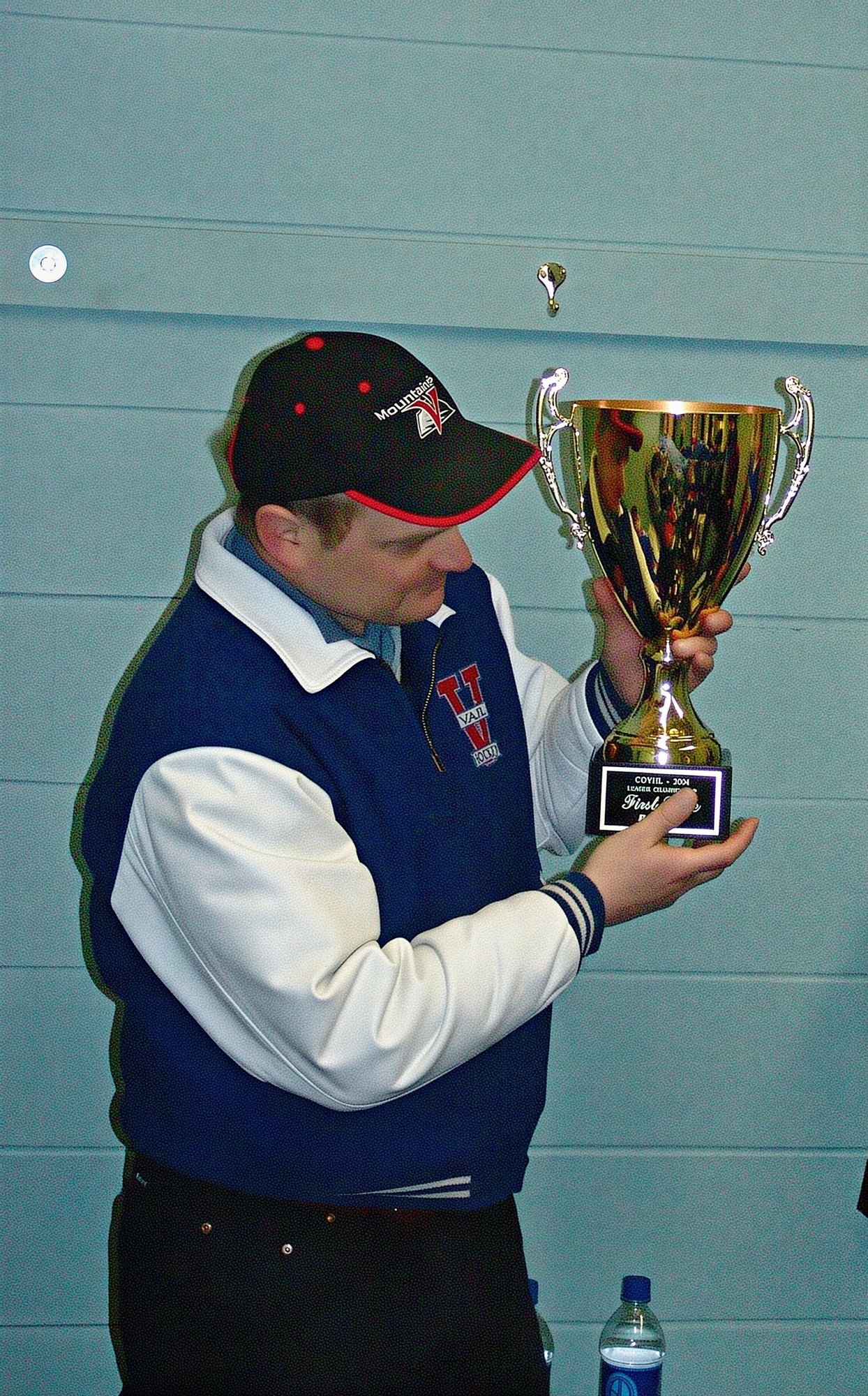 Coach Barry Biegler inspecting the cup.   Before beating Steamboat Springs twice to win the championship, we had lost to them all three games by scores of 6-2,  3-0 and 4-0, total score 13-2.   Amazing to win twice for the league championship.