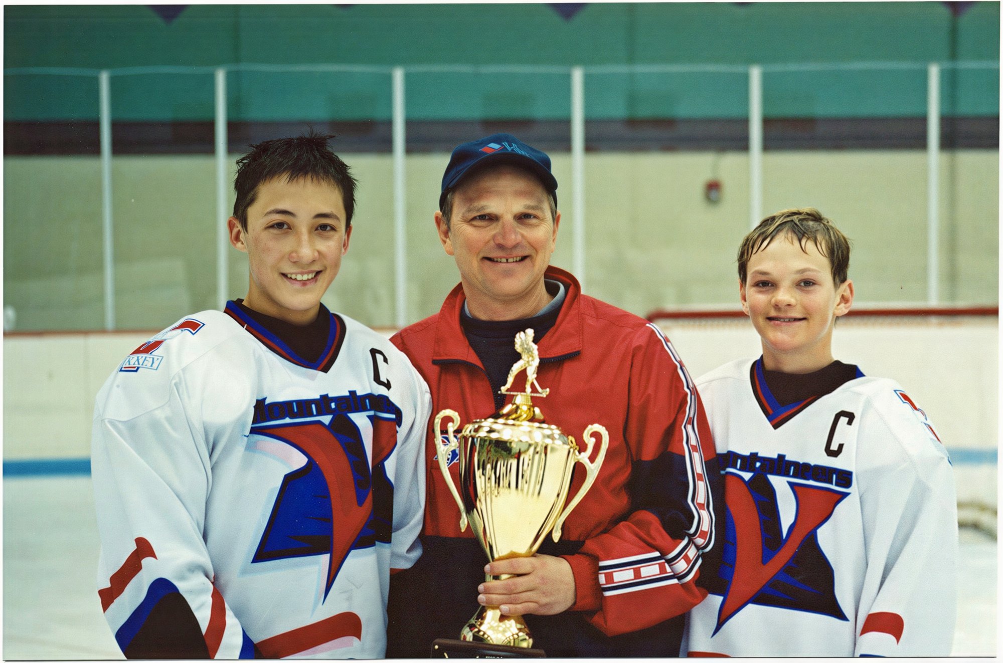 Coach Barry with the Peewee A Colorado State Championship Trophy with Captains Austin Chow and Alex Biegler