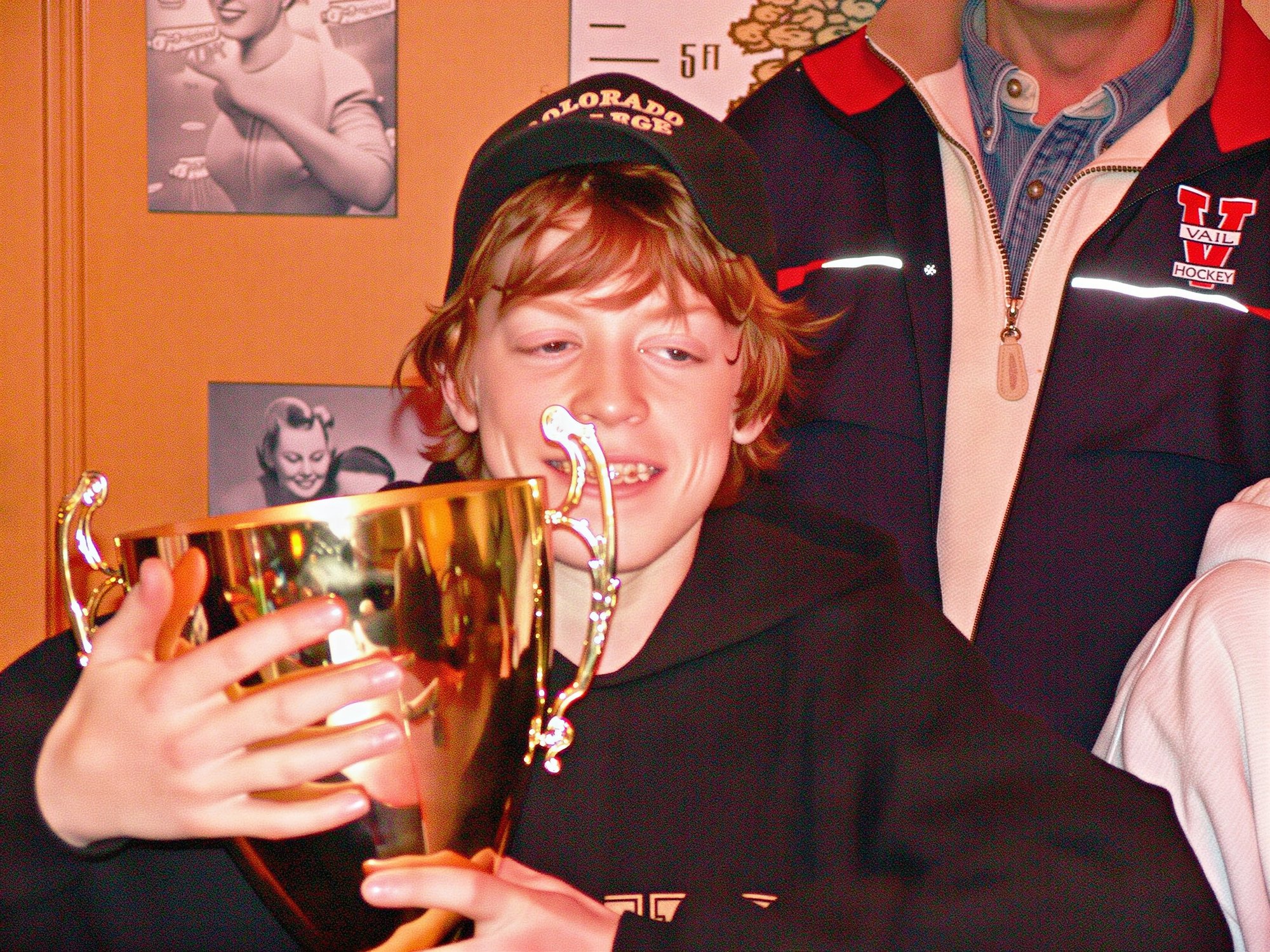 Captain Casey Kleisinger may never let go of the cup!  He sure earned it.  A hat trick, including the winning goal in overtime! 

Steamboat used to always get him to fight instead of score goals.  He wouldn't have the cup if he had been a goon in the championship!